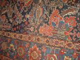 Cloeup of Entry Hall Heriz Rug it is 12 ft x 21.7 ft. Does have 2 spots
which may be wear or moth spots...