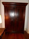 Oversized Flame Mahogany Armoire. Lousiana. Has Detailind down
each side.   Ca. 1840-1860.  From the Quarters