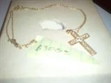 14 kt gold cross and Chain. No weight available