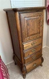 Brass Adorned Oak Slender Cabinet Dimensions: (HxWxD in) 54x24x20in