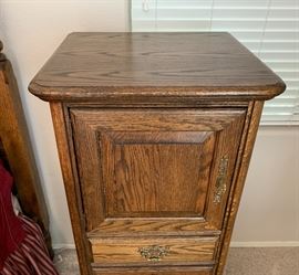 Brass Adorned Oak Slender Cabinet Dimensions: (HxWxD in) 54x24x20in