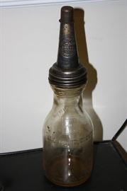 Antique motor oil bottle and spout.  This is not a re-make.  It is the real deal!