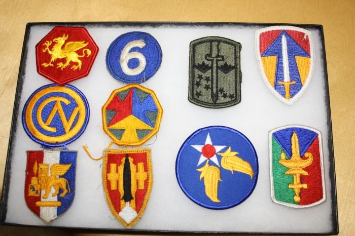 There is a large collection of Military Patches, Badges, Medals, and more