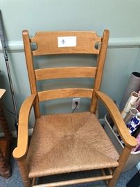 One of a pair of rush seat arm chairs