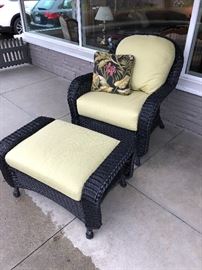 Outdoor wicker chair and ottoman with cushions.  Sold with matching love seat 