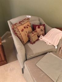 Custom chair and ottoman shown with needlepoint pillows