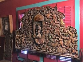 Large backsplash, Mexican origin, hand carved, depicting Madonna figure, fruit, florals. 80" wide x 46" tall 