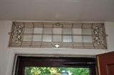 stained plexiglass above-door transom (over front door)