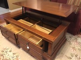 The tops lifts to you for dinner! The front side has great storage!