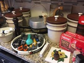 Stoneware canisters, lots of misc tools for the chef.