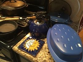 Cast iron cookware, and blue decor.