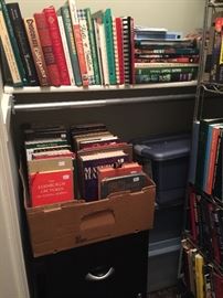 More books, storage bins, filing cabinet.