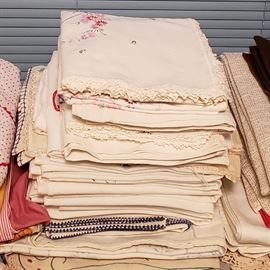 Many embroidered linens, aprons, etc.