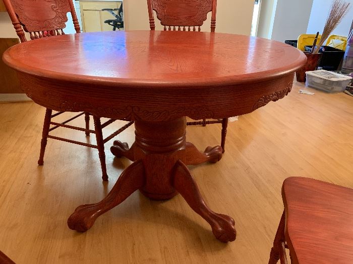 Red Stained Carved Oak Table & 4 Chairs	45in diameter x 29.5inH	