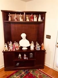 Plaster bust in middle/mahogany flatscreen TV stand