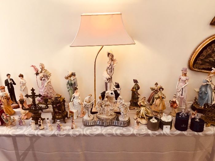 Lady figurines with Armani lamp in middle