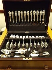 151 piece set of "Grande Baroque" sterling silver flatware, by Wallace, in a large mahogany case, lined with pacific cloth - over 18 POUNDS of sterling!          How to best clean sterling, I have no idea - I have a maid!  ;-)
