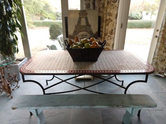 What a lovely way to spend a day!                                             On this glassed-in porch, you can pretend you're once again enjoying a French picnic at the Tuileries Gardens! The aged French blue wooden bench is the pièce de résistance!