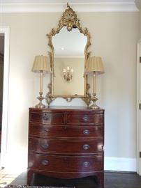 Antique English mahogany 5-drawer chest, with pencil inlay, pair of wooden candlestick lamps and 5' tall antique French gilt mirror.