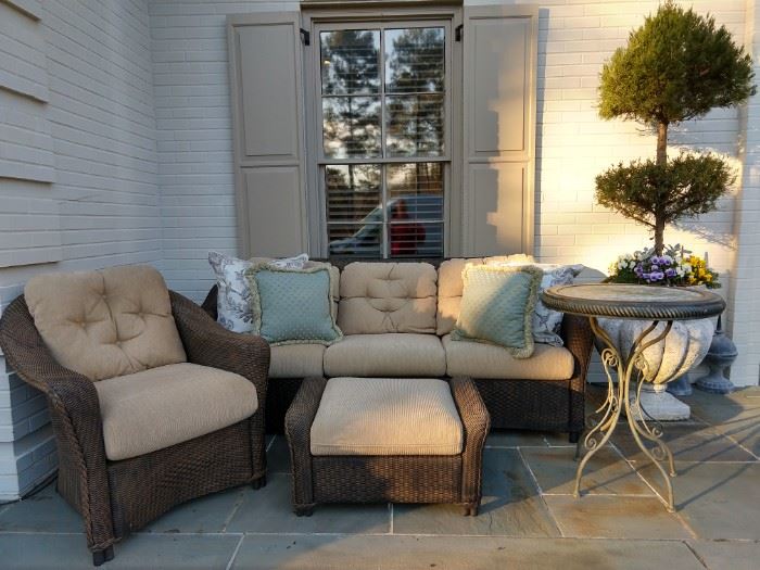 Very comfy grouping of outdoor rattan furniture, by Lloyd Looms.