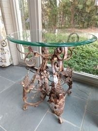 LOVE all the curlicues on this perfectly aged wrought iron table, with beveled edge glass top!