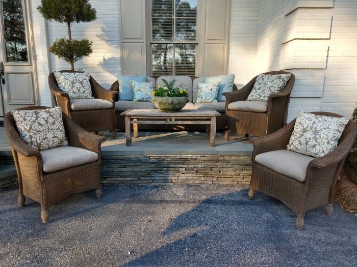 Another grouping of all-weather wicker, by Lloyd Looms furniture, with Smith & Hawken teak coffee table. 