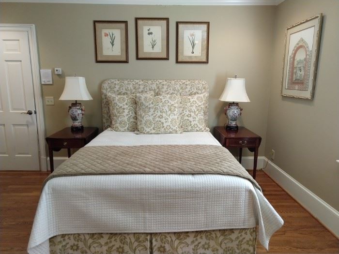 Beautifully appointed queen size bed, with custom linen fabrics, with SealyPosturepedic Preferred Series Plush Pillowtop mattress.  Pair of Baker drop-leaf mahogany Pembroke tables, with pencil inlay and cascading bellflowers and pair of Asian porcelain table lamps. You can see three of the set of seven NY Botanical Garden prints. 