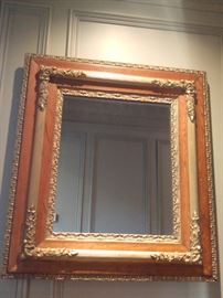 One of a pair of oak/gilt wood wall mirrors. 