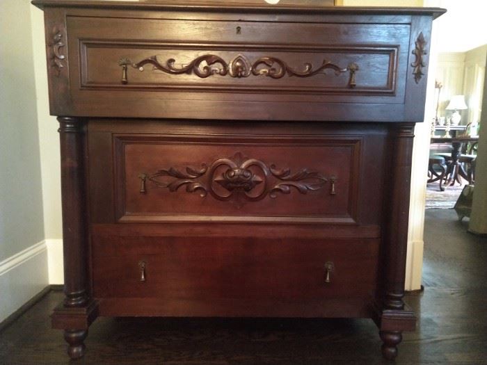 Take a look a this piece!                                                                
One-of-a-kind, this walnut organ chest (3 drawers, carved, pre-1850, was in the First Presbyterian Church in Roswell, brought when still an organ, to Bulloch Hall for the wedding of Mittie Bulloch and Theodore Roosevelt's Father. 