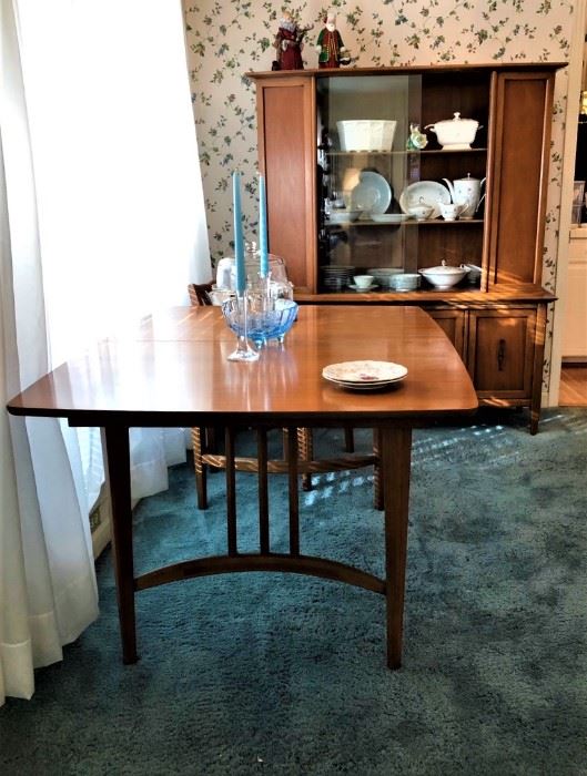 midcentury dining table with six chairs and extra leaf.