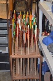 Arrows and wooden arrow stand. Most arrows are also wood. Two Wooden Bows. $135