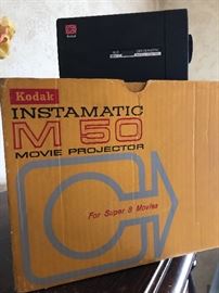 Kodak Instamatic M50 Movie Projector and M2 Instamatic Camera. Projector screen also available.