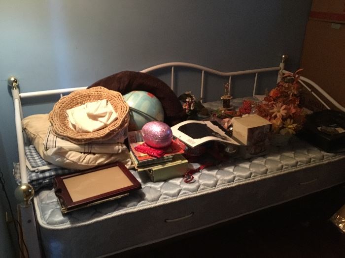 Daybed with lots of miscellaneous items