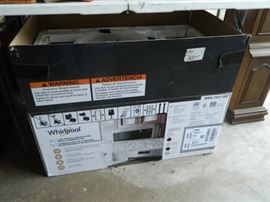 New in box Whirlpool Vent hood/Microwave