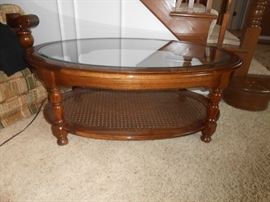 Glass top oval table in living room - left of front door