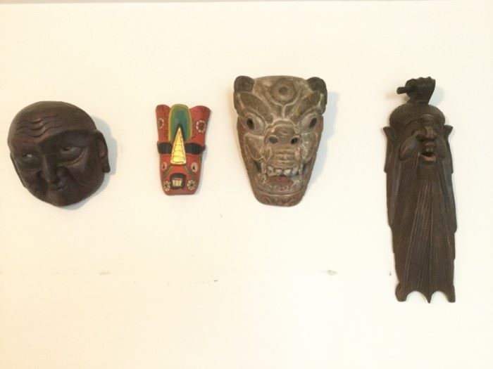 Set of 4 Wood-Carved Masks https://ctbids.com/#!/description/share/86822