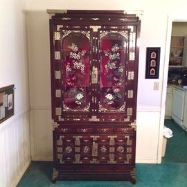 Vintage Korean Display cabinet with mother of pearl inlay, hand painted glass, and detailed brass hardware. 