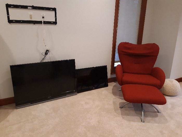 Televisions and modern chair
