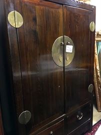 Asian elm and brass armoire