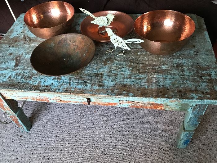 Rustic painted coffee table, metal birds and more copper.