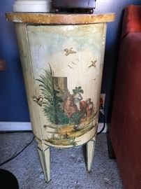 Cylindrical painted cabinet on  legs.