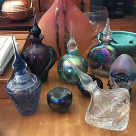 Assorted glass perfume bottles.