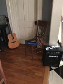 Hartke Amp, Acoustic guitar, recorder, silk flowers and chair without seat