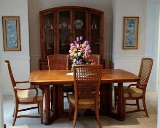 Beautiful Wood Dining Room Suite includes Table with 6 Wicker Back Chairs and a Large China Cabinet 