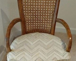 Single chair from the Dining Room Suite, showing wood arms that are on two of the Chairs