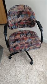 Black metal rolling Dinette Chair upholstered in attractive colorful fabric