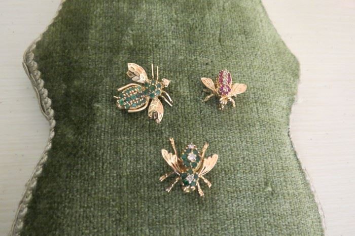 14k gold and gemstone bee pins.