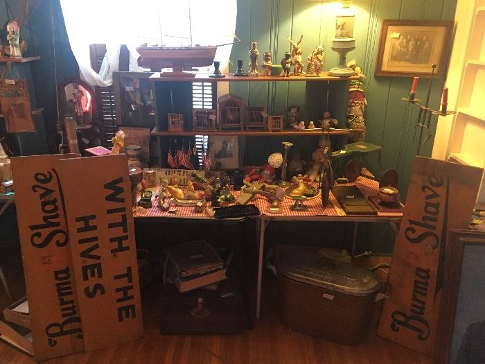 various figurines, boat, Burma Shave signs, wood tricycle