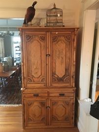 German one piece cupboard, vintage bird cage, stuffed pheasant