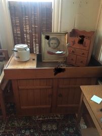 Antique dry sink lined with copper, Rosedale crock with lid, Currier and Ives print, pipe holder with birds